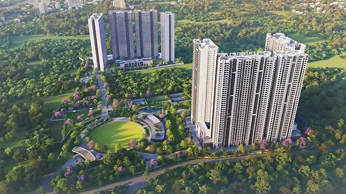 Exterior view of Embassy Lake Terraces showing modern architecture with lush greenery and towers