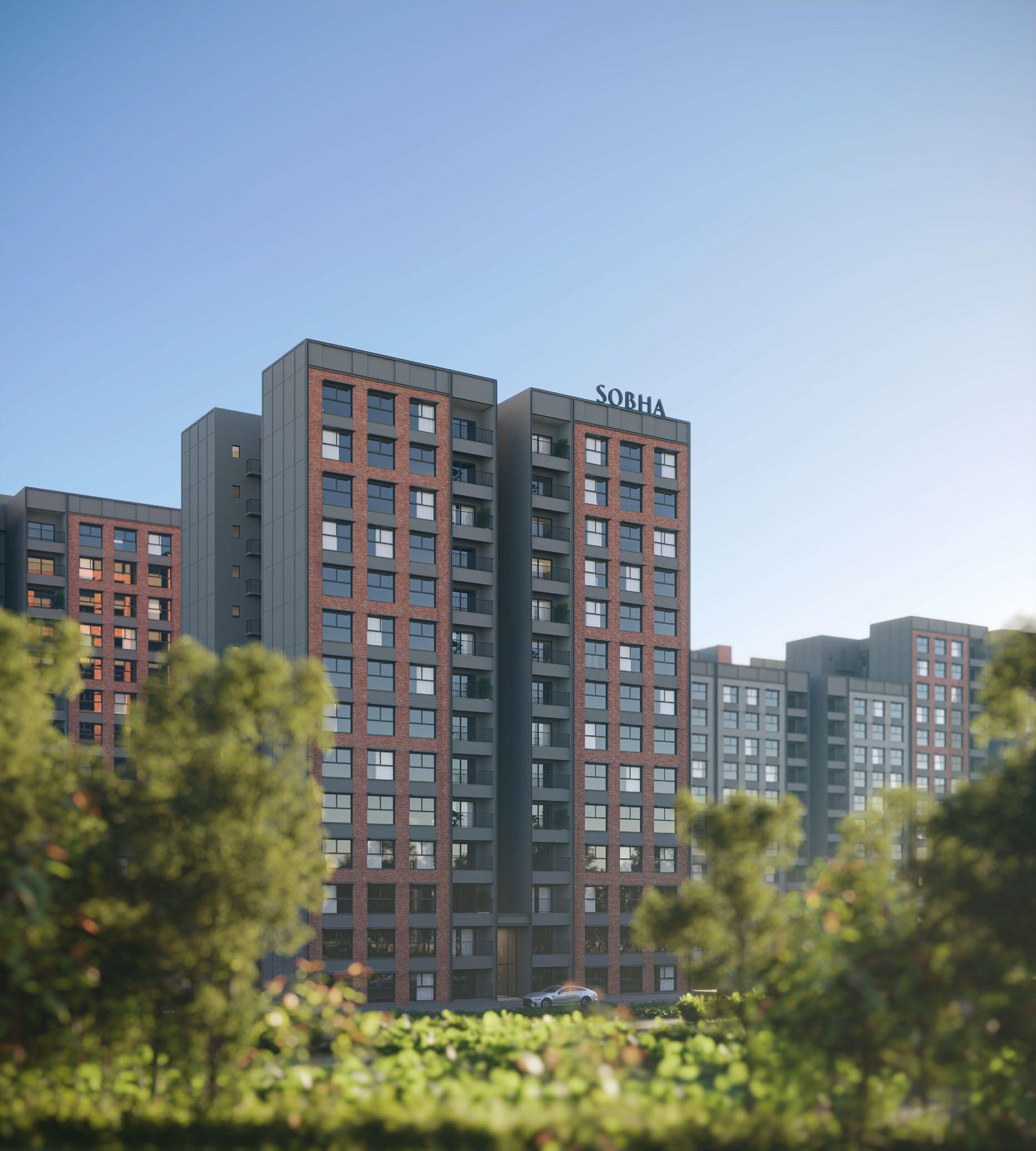 Modern apartment buildings with glass facades and a clear sky
